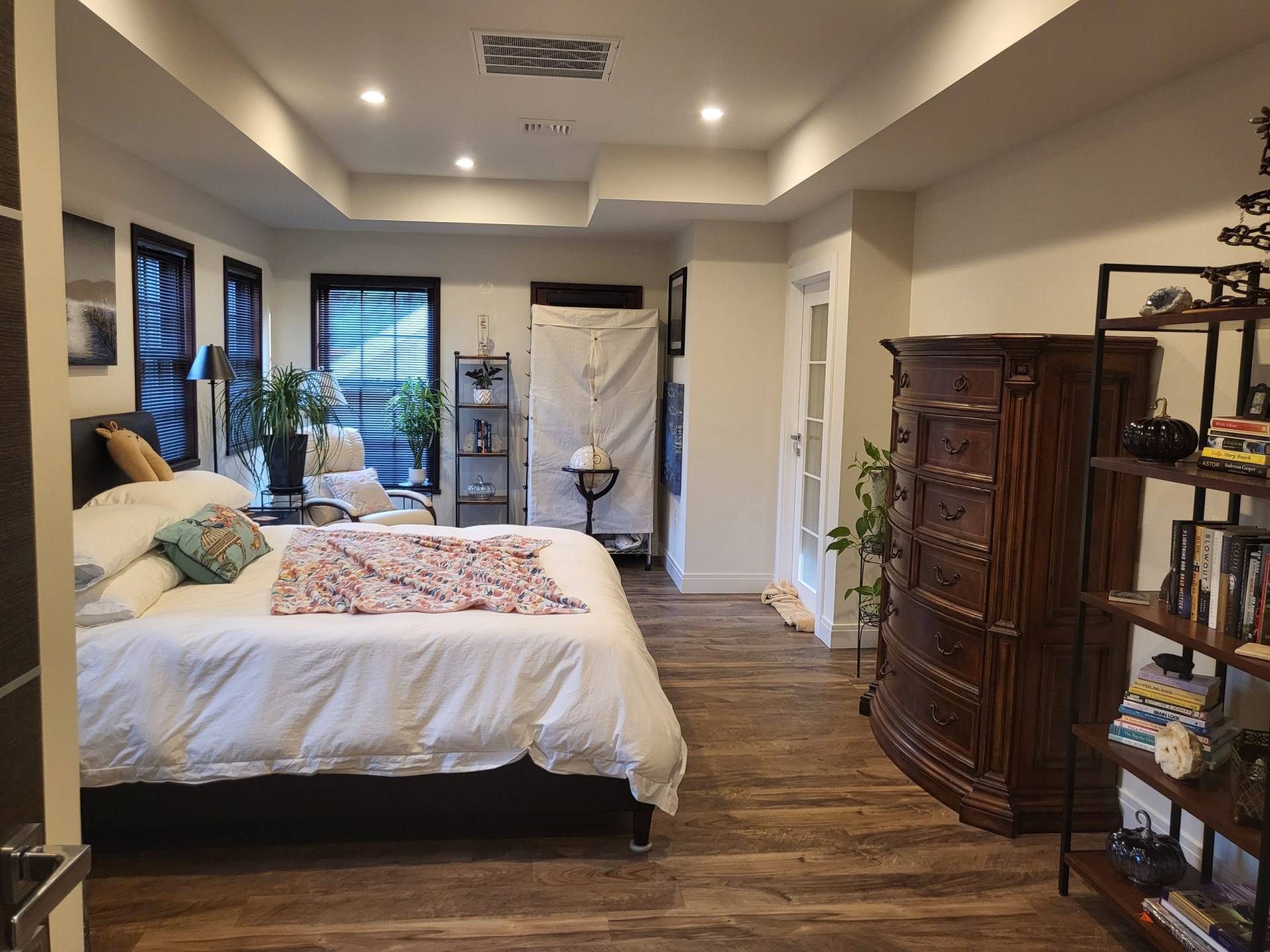 Custom second floor bedroom with tray ceiling and luxury vinyl tile floors. Designed by Brad M. Zahm, RA, NCARB and The Mula Group